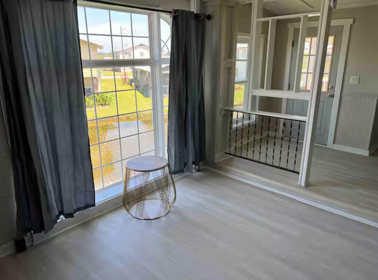 Image 4: Spacious Family Room Featuring Oversized Window by