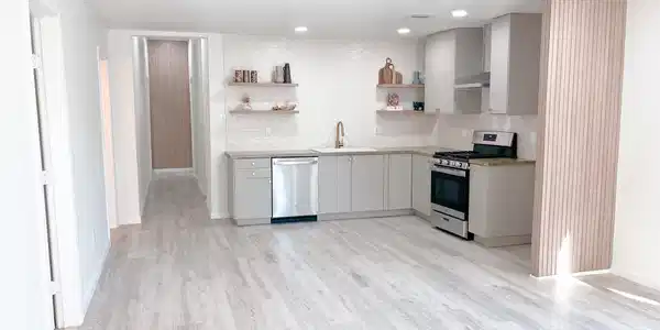 Image 4: warm earth-tone colors and tiled backsplash adds a