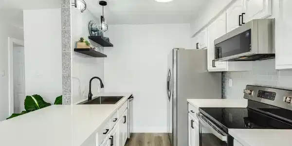 Image 2: Tons of cabinets, quartz countertops, new hardware