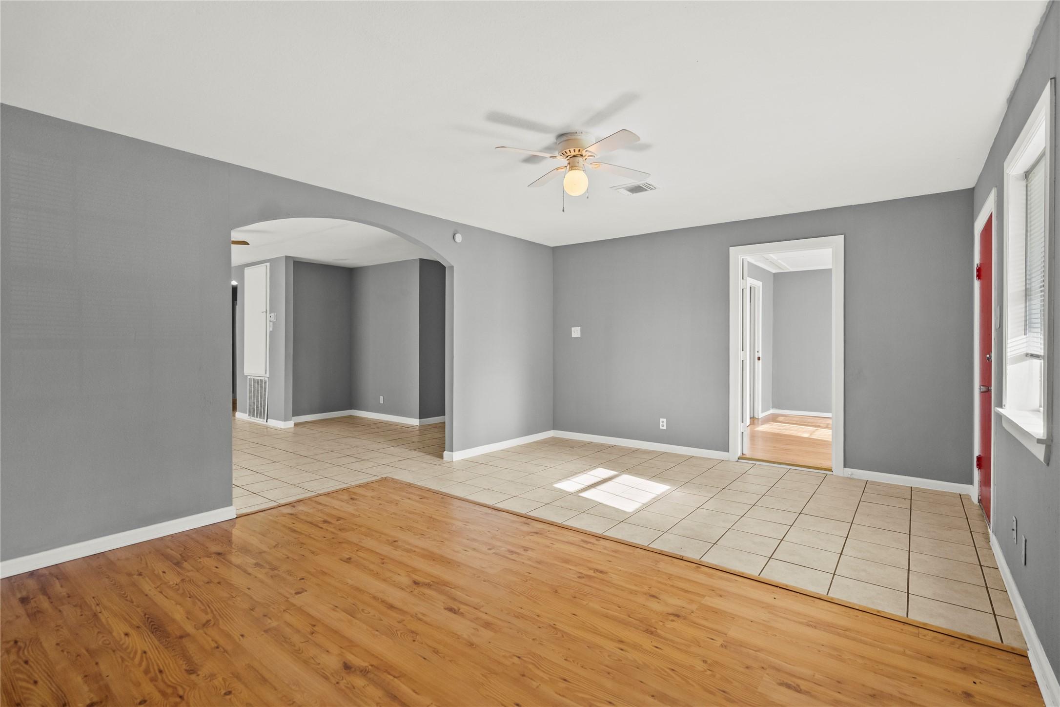 Image 4: Large living room with nice archway leading into t