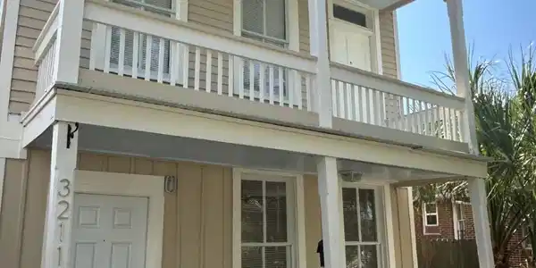 Image 2: The original 1895 main house has clapboard exterio