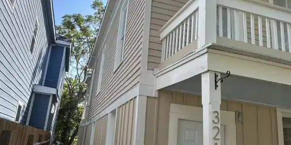 Image 3: East side of the house. Backyard is fenced.