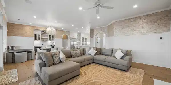 Image 2: The living room opens effortlessly to the dining a