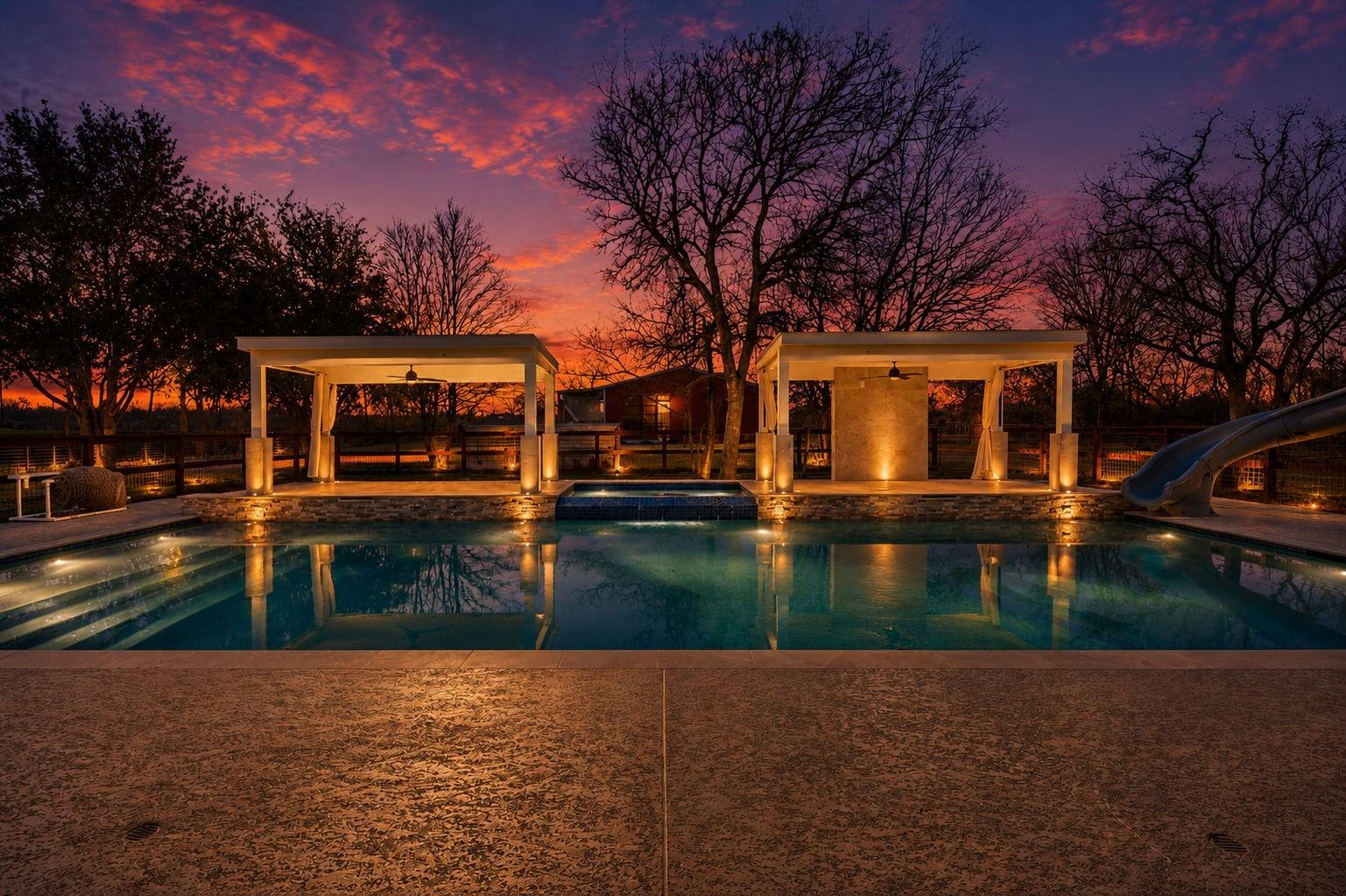 Image 3: This photo showcases a luxurious backyard with a b