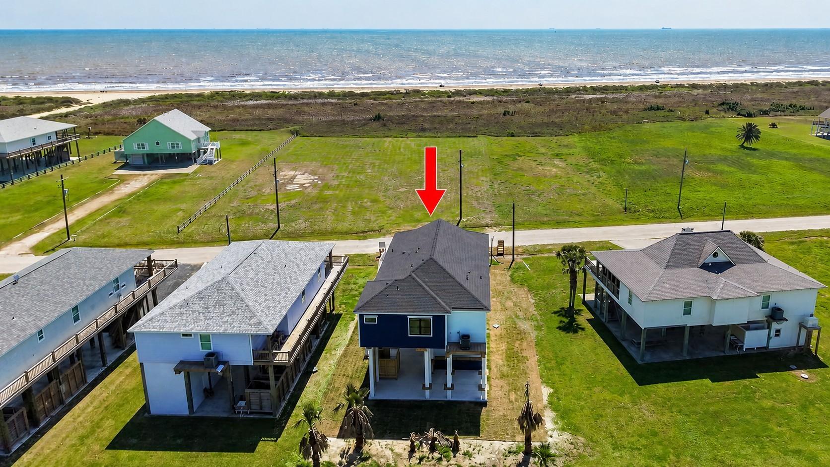Image 3: This photo shows a coastal property with a modern