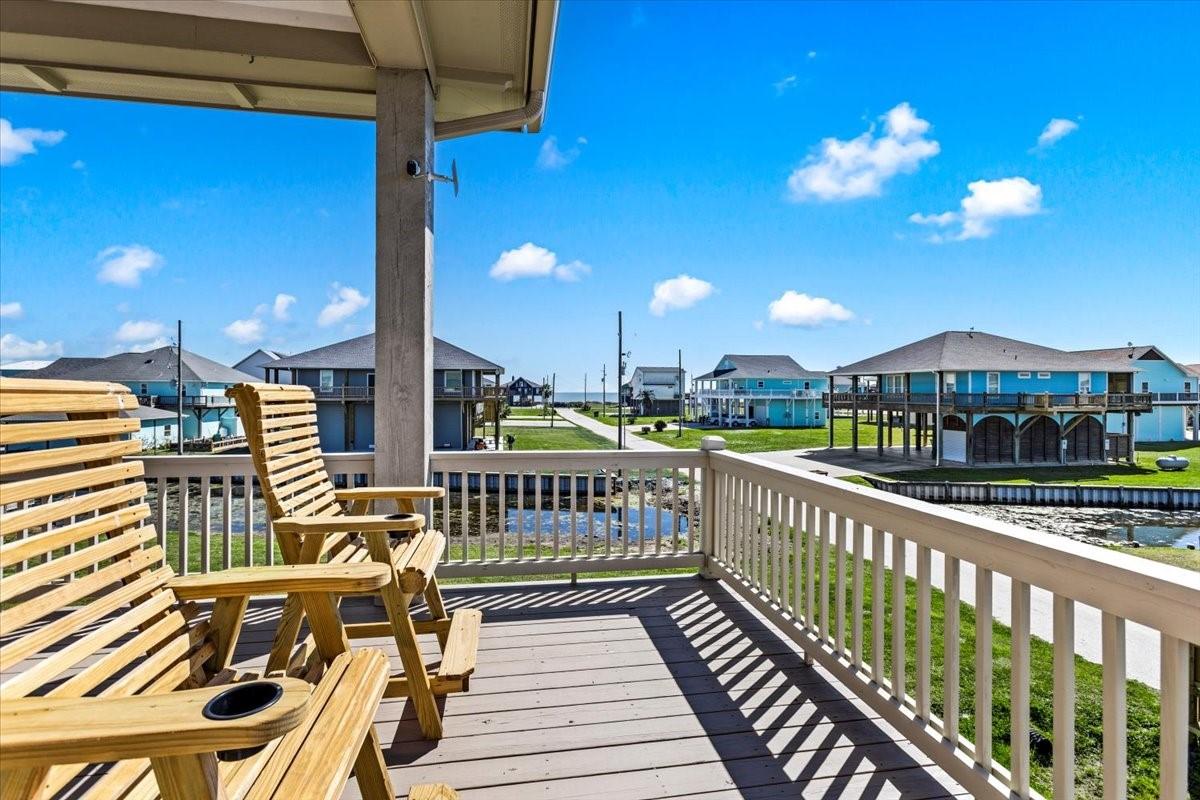 Image 3: Relax on the charming wooden deck, offering serene