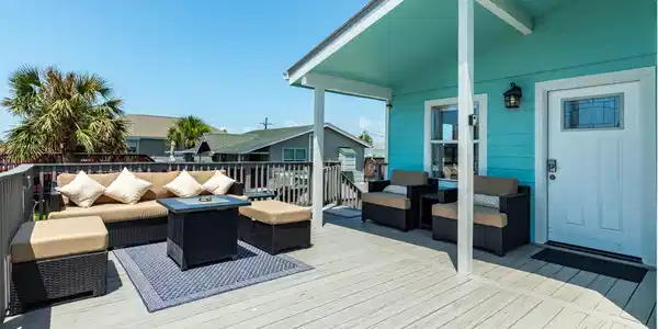 Image 3: Large deck space with plenty of seating and a fire