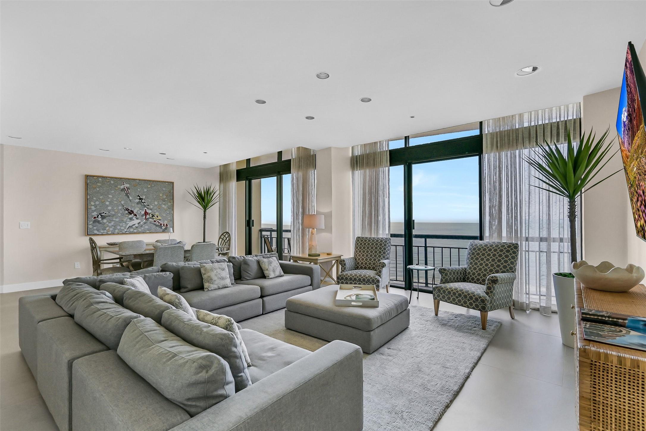 Image 4: Living & dining area with two private balconies