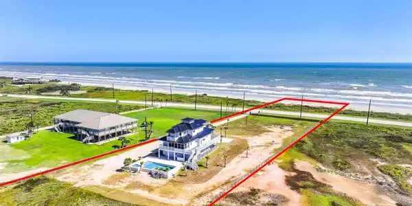 Image 2: Over an acre of private beachfront puts the Gulf a