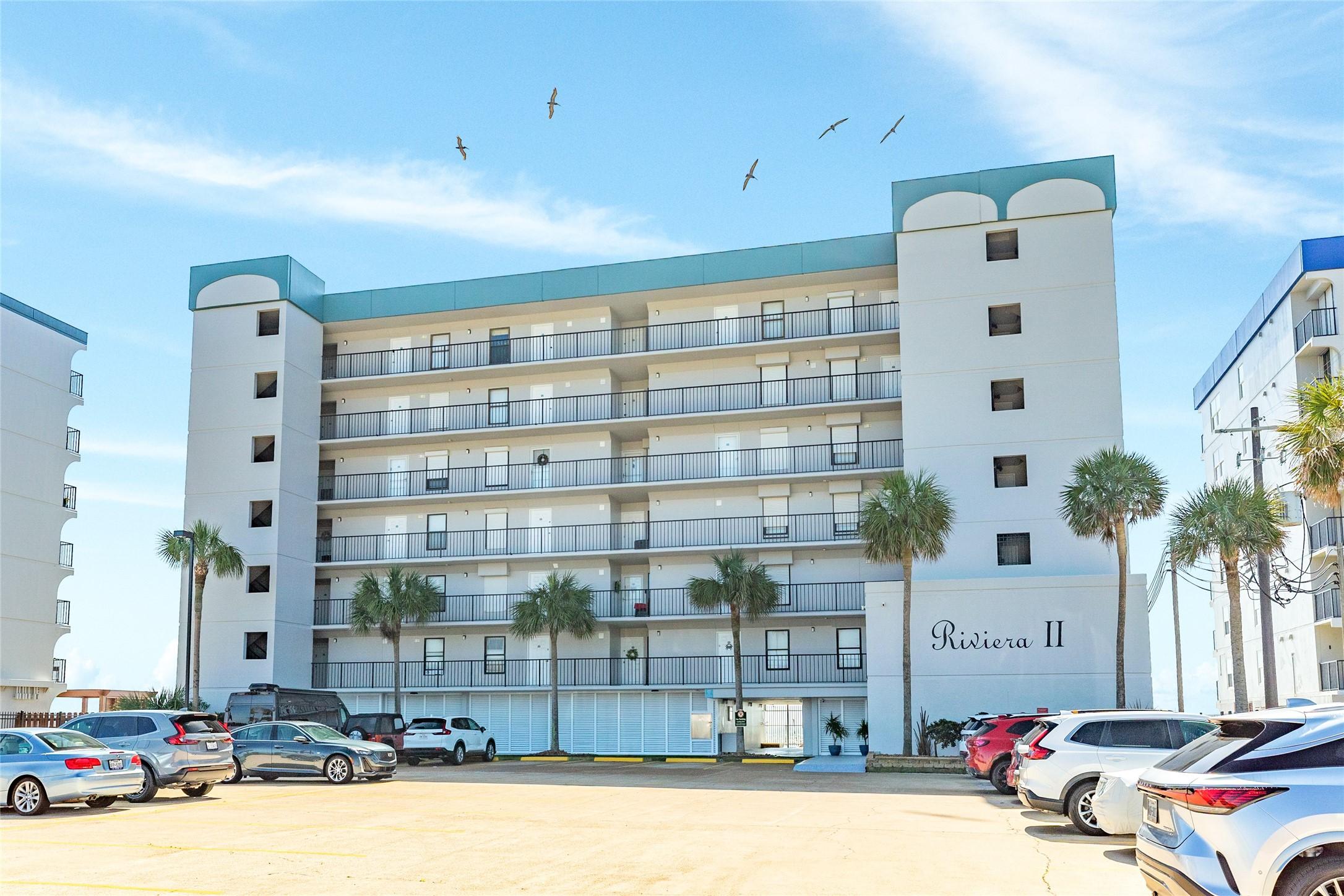 Image 2: Riviera II with gated entrance and surface parking