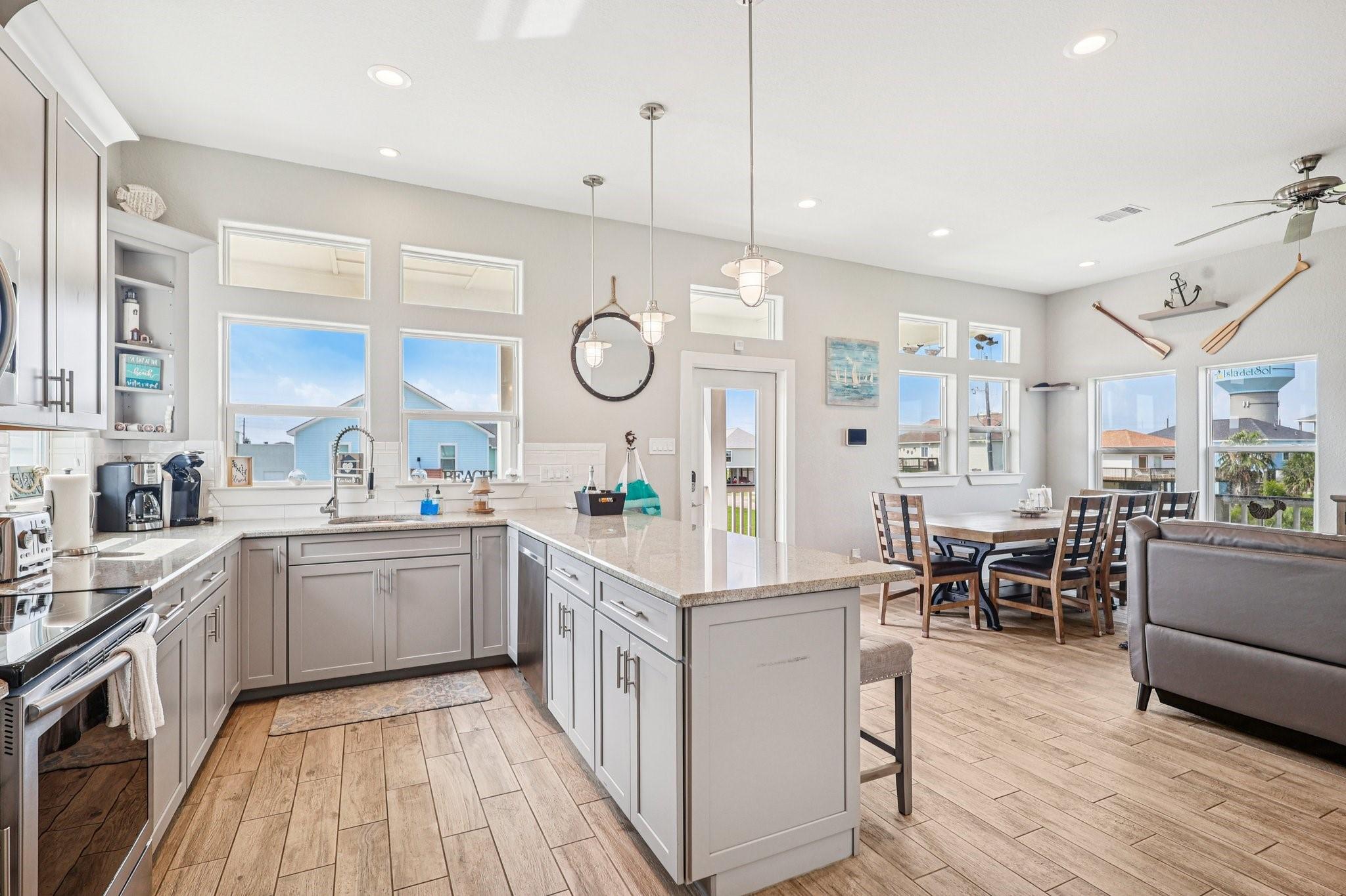 Image 2: Large modern kitchen with lots of
 countertop spa