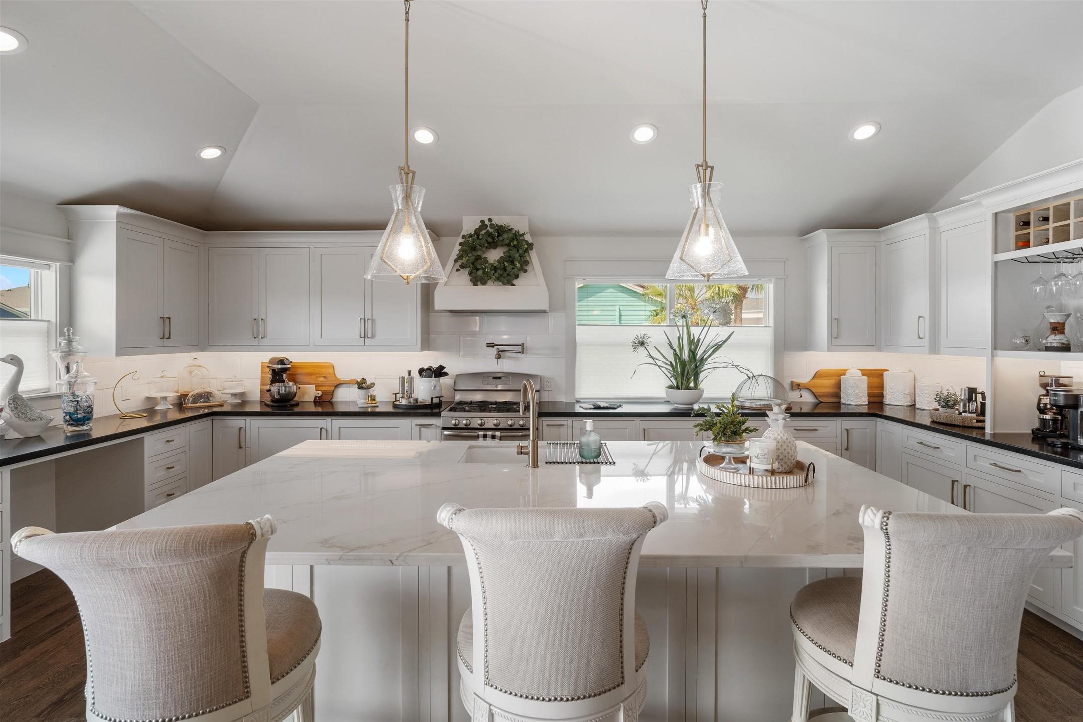 Image 2: This kitchen is the hub of the home. The shear siz