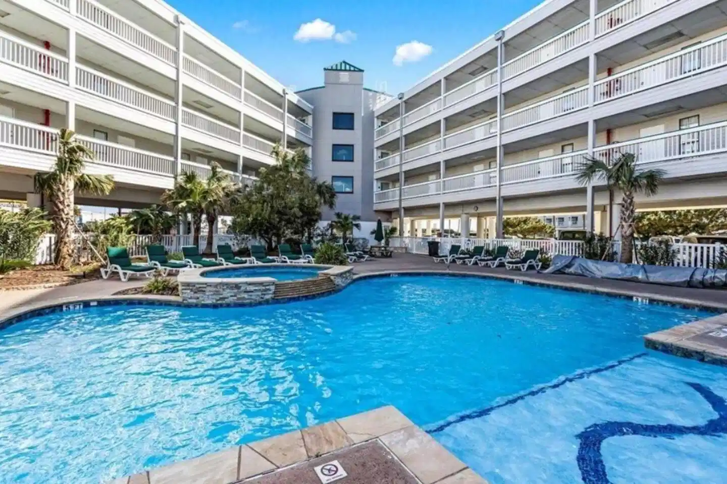 Image 1: One of two relaxing pools at Casa del Mar complex