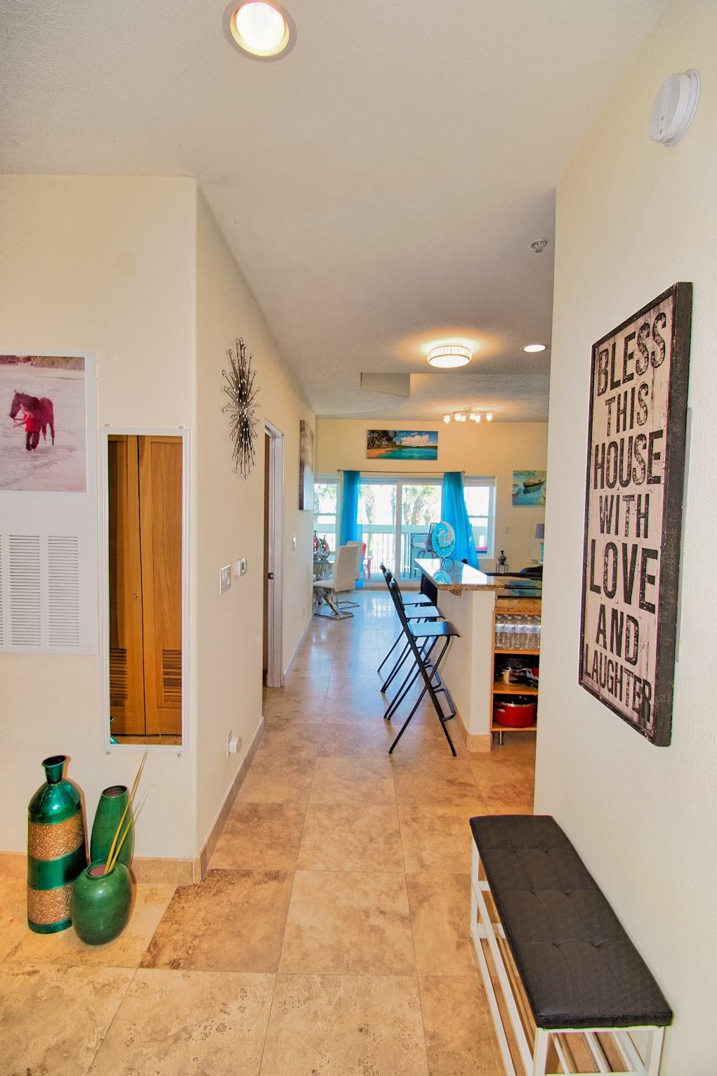 Image 4: Welcoming entry hallway with tile flooring, leadin