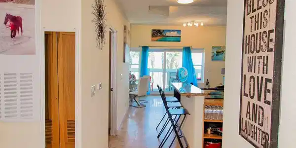 Image 4: Welcoming entry hallway with tile flooring, leadin