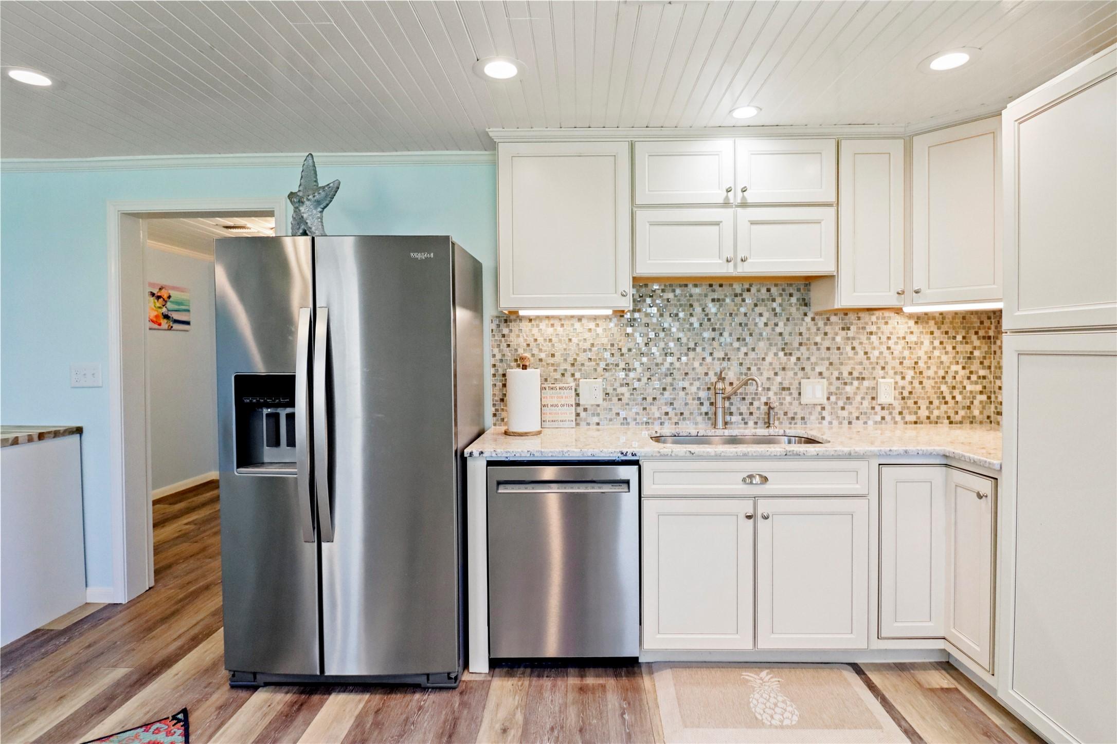 Image 4: This kitchen features modern stainless steel appli