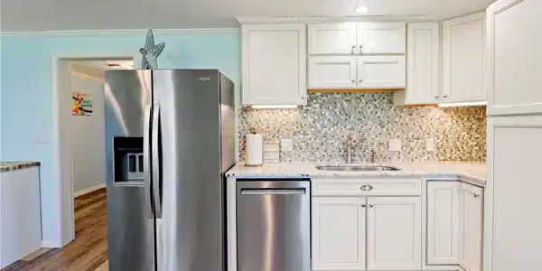 Image 4: This kitchen features modern stainless steel appli
