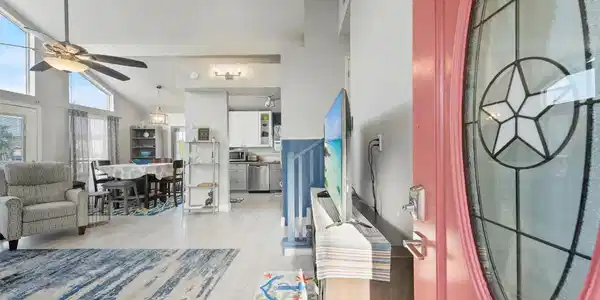 Image 3: Upon entering are high ceilings, natural lighting,