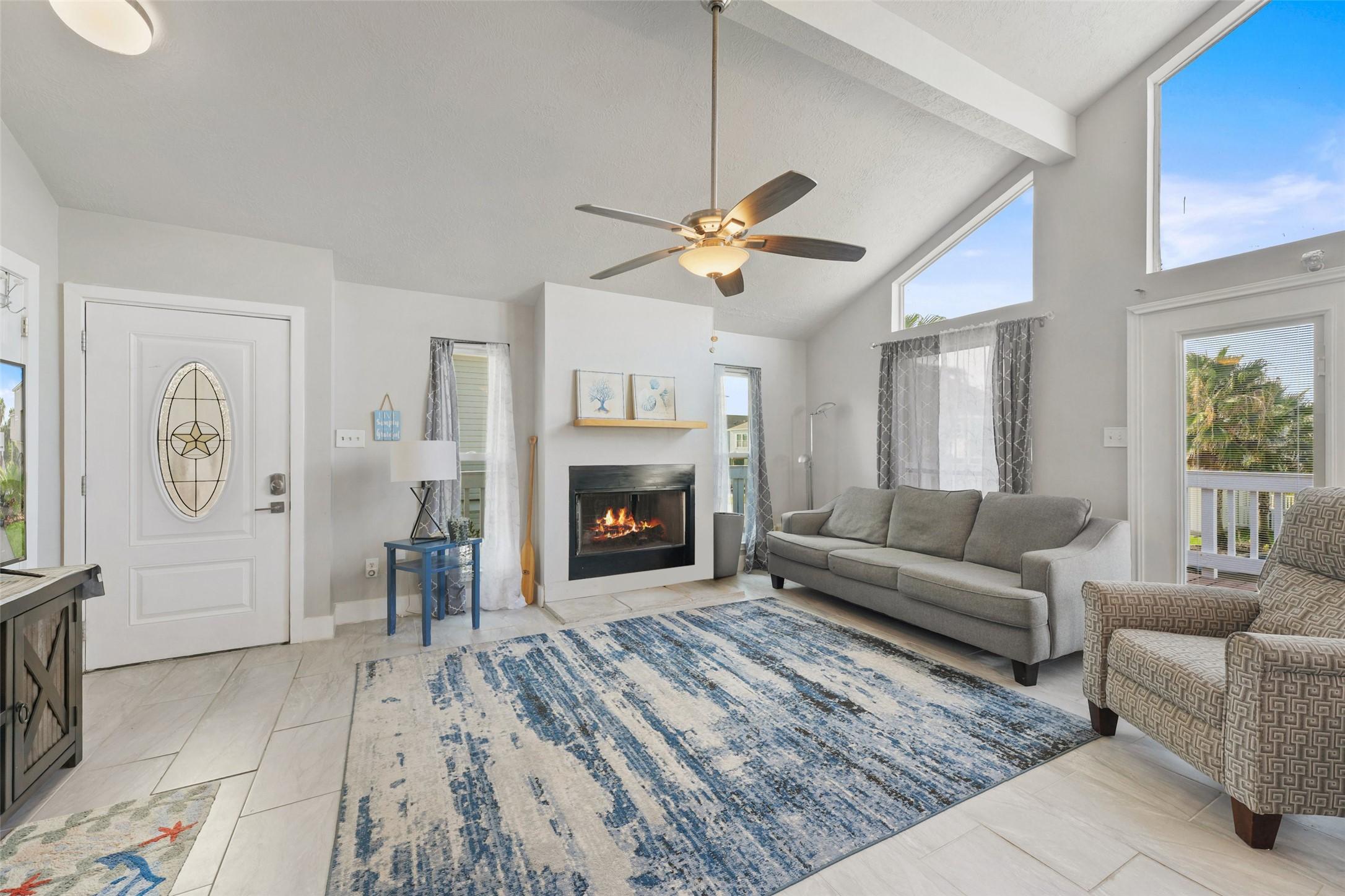 Image 4: The welcoming living room features tile flooring,
