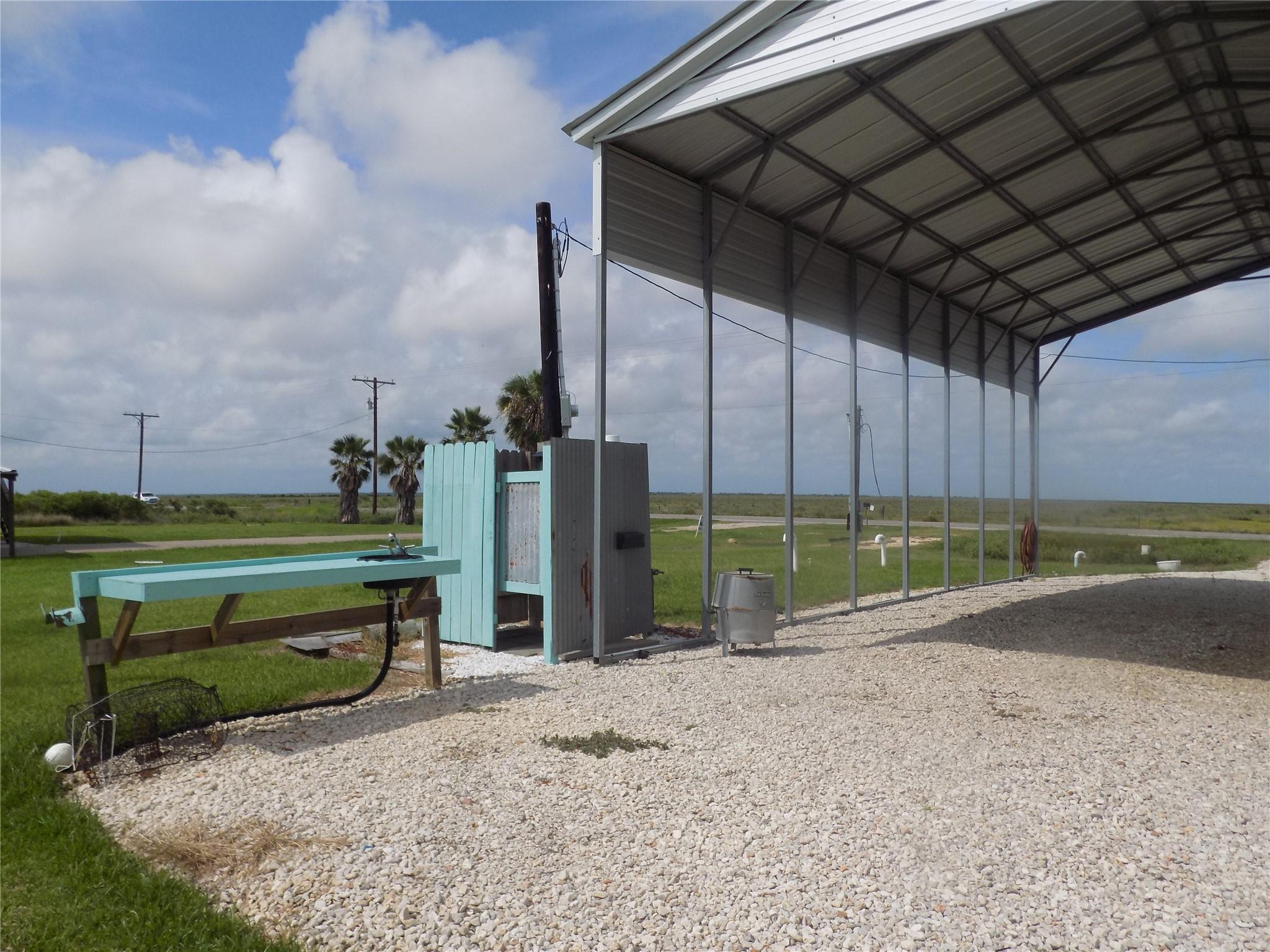 Image 2: Outdoor shower and fish cleaning area.