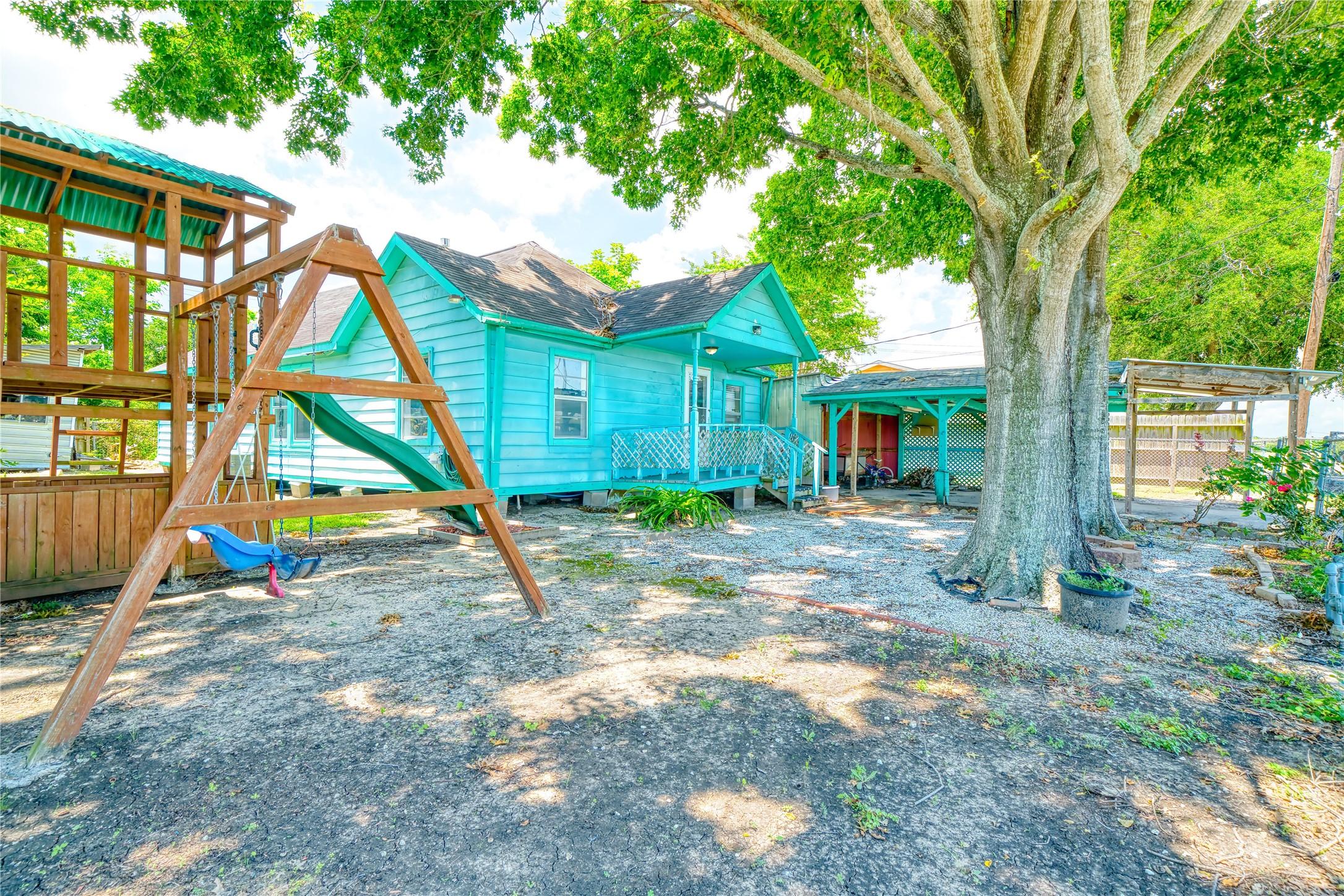 Image 3: safe front yard and playground with lots of shade