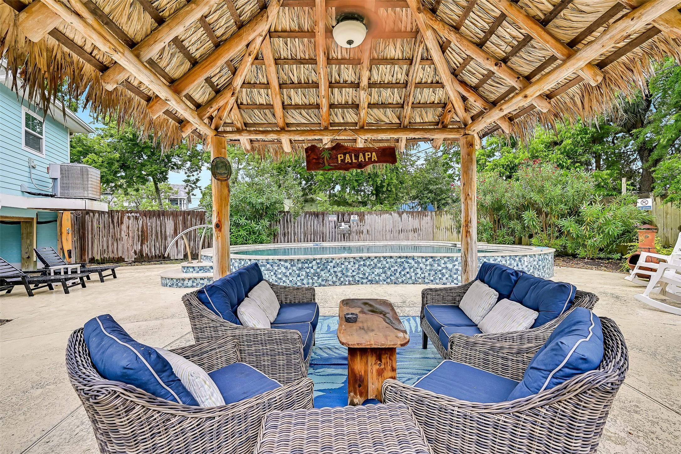 Image 4: The oversized covered patio creates the perfect ou