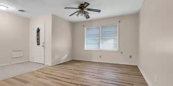 Image 3: Bright, freshly updated interior featuring wood-st
