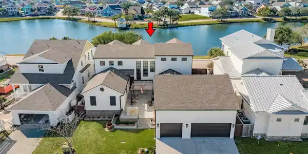 Image 4: Home sits on 2 lots.  Back view of home.  Outdoor