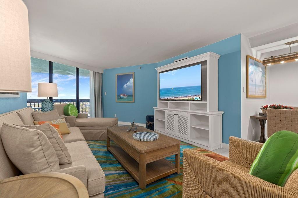 Image 3: This bright and inviting living room features a co