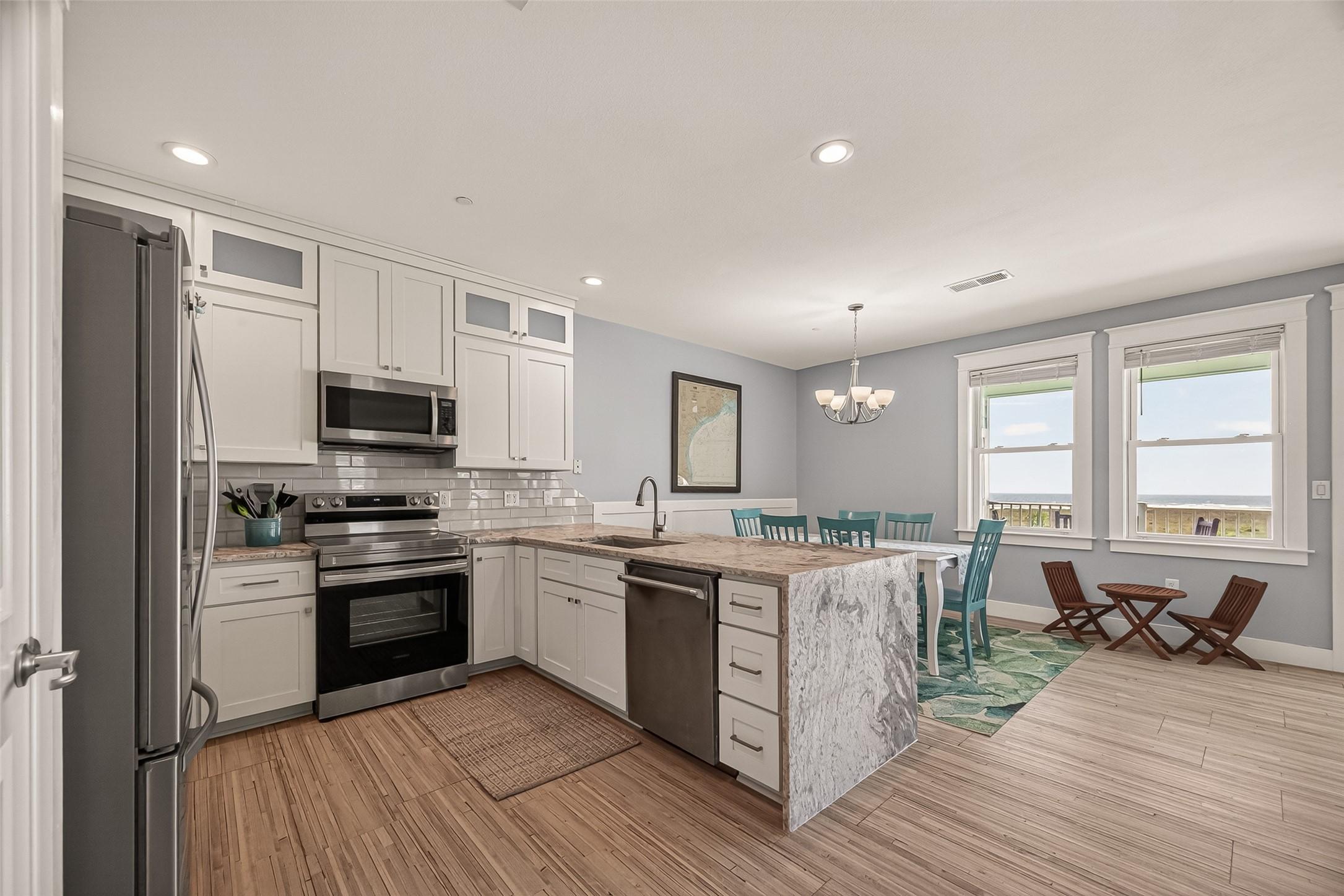 Image 4: Another shot of the remodeled kitchen, it all flow