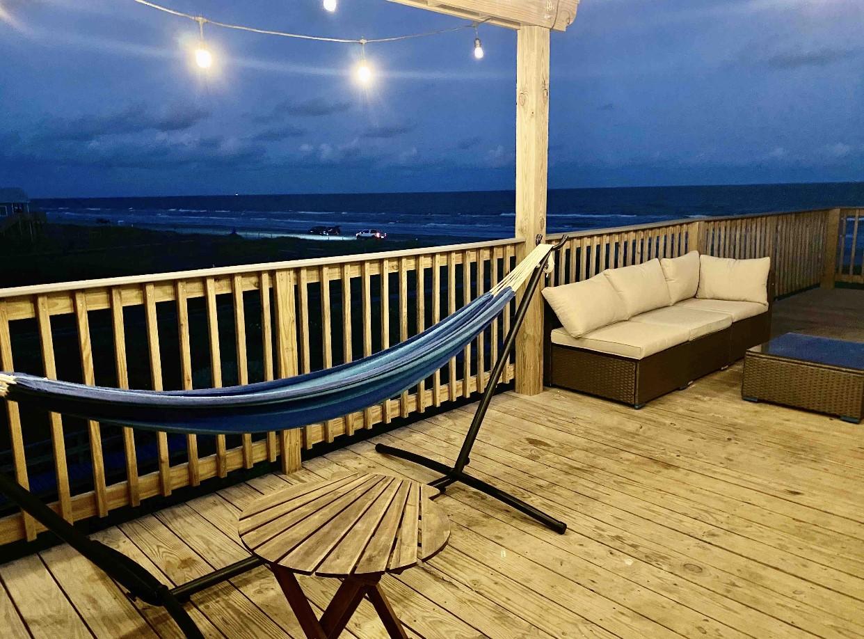 Image 2: evening view of the front balcony
