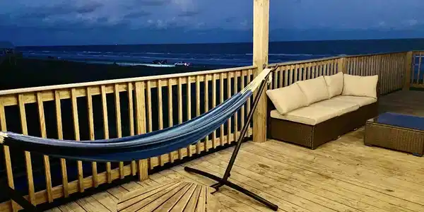 Image 2: evening view of the front balcony