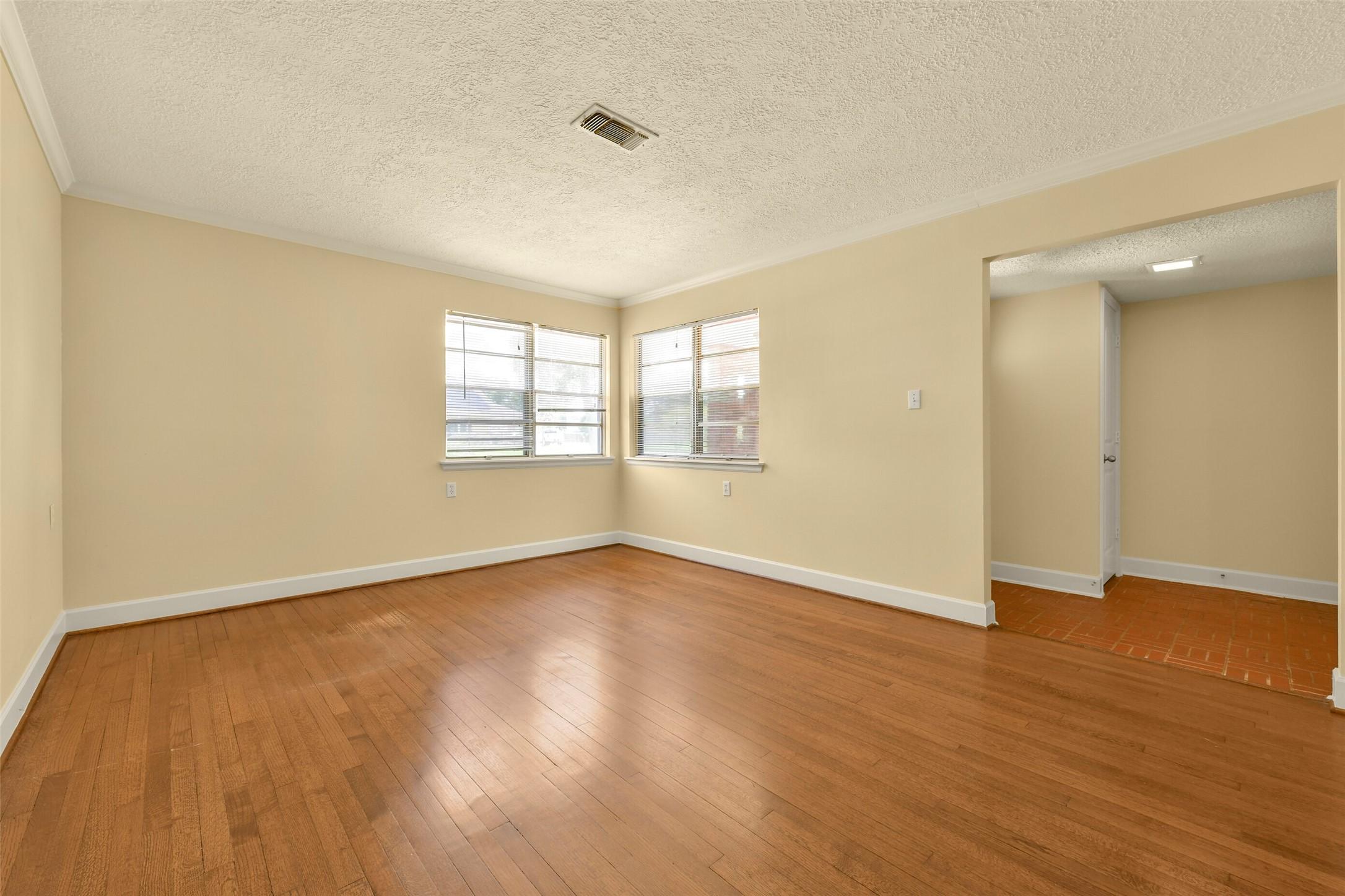 Image 3: Formal Living Room with wood floors as you enter t