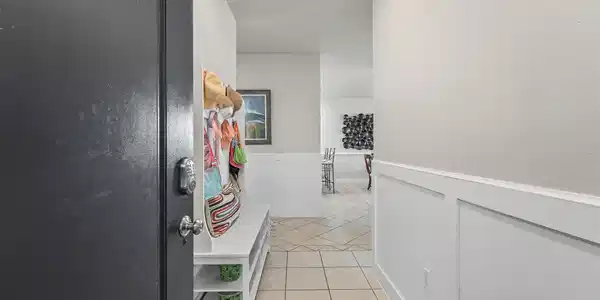 Image 2: Step inside through a bright entryway that sets th
