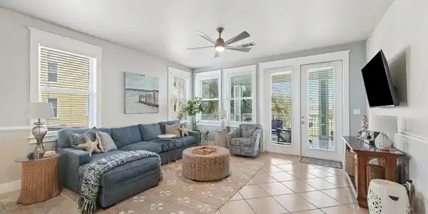 Image 3: The main living space is filled with natural light