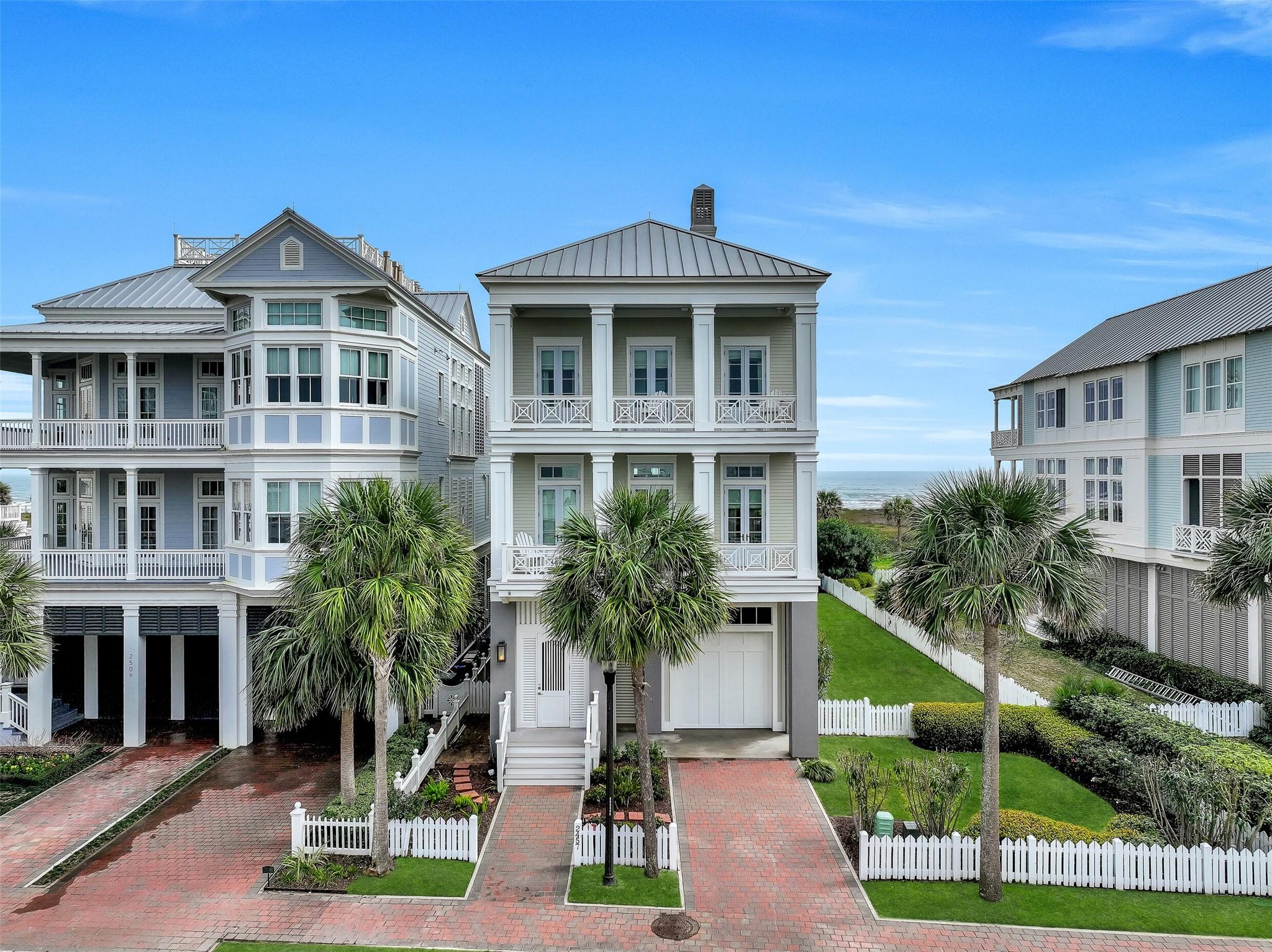 Image 3: Beautiful street side view of home with double por
