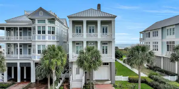 Image 3: Beautiful street side view of home with double por