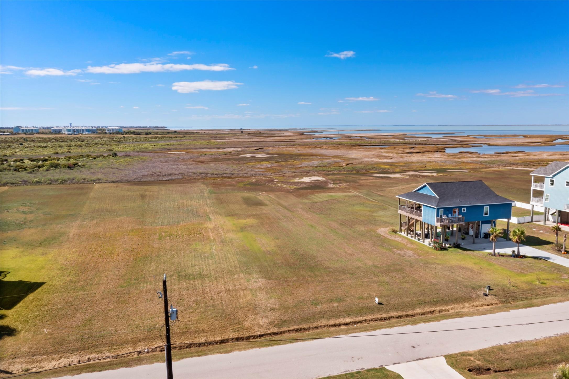 Image 3: This photo showcases a spacious coastal property,