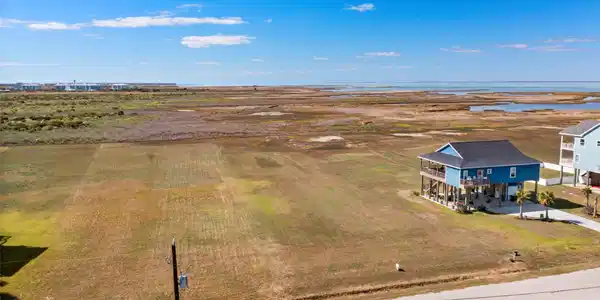 Image 3: This photo showcases a spacious coastal property,