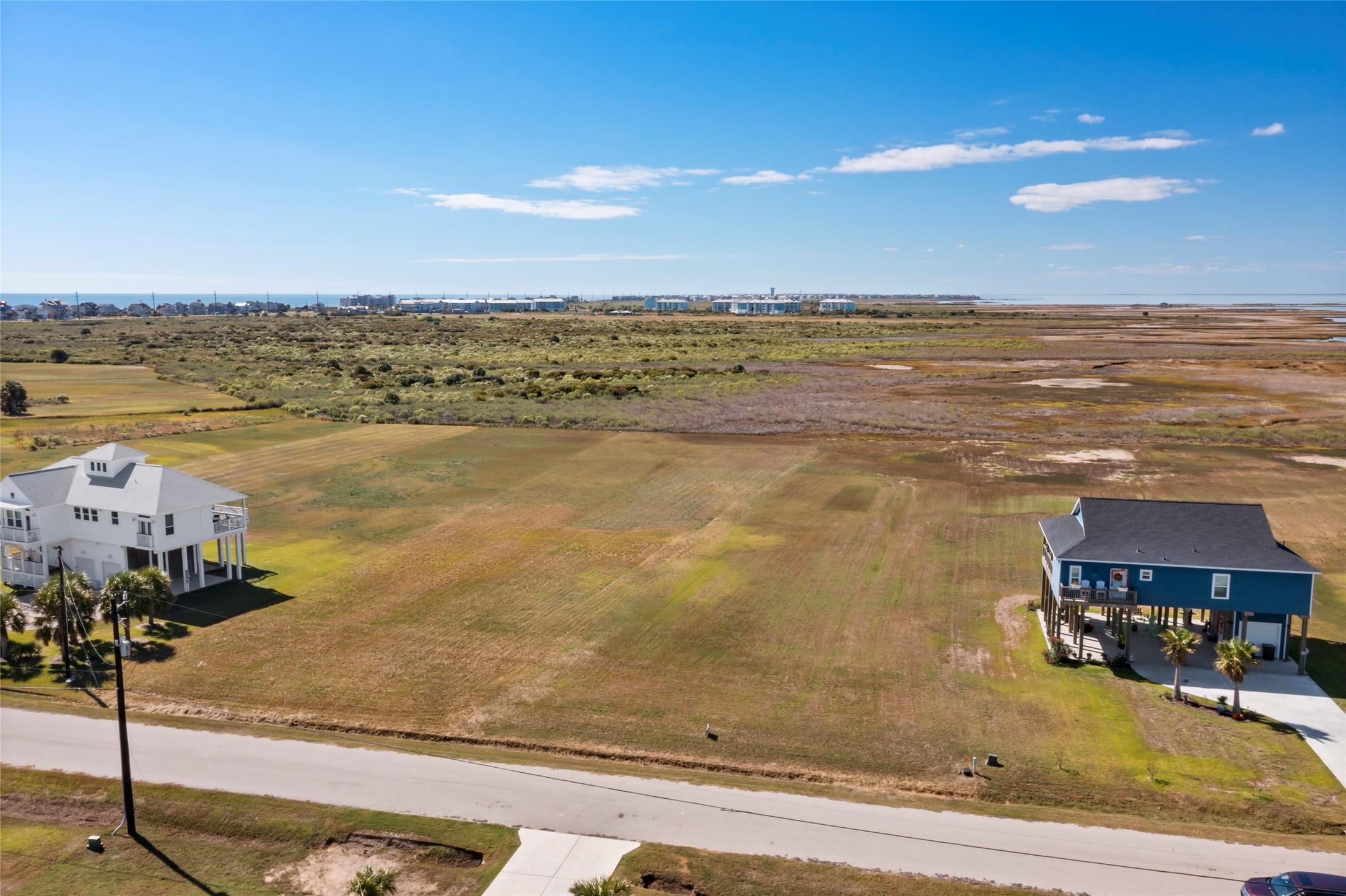 Image 4: This photo showcases a large, open plot of land wi