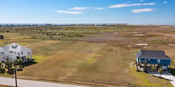 Image 4: This photo showcases a large, open plot of land wi