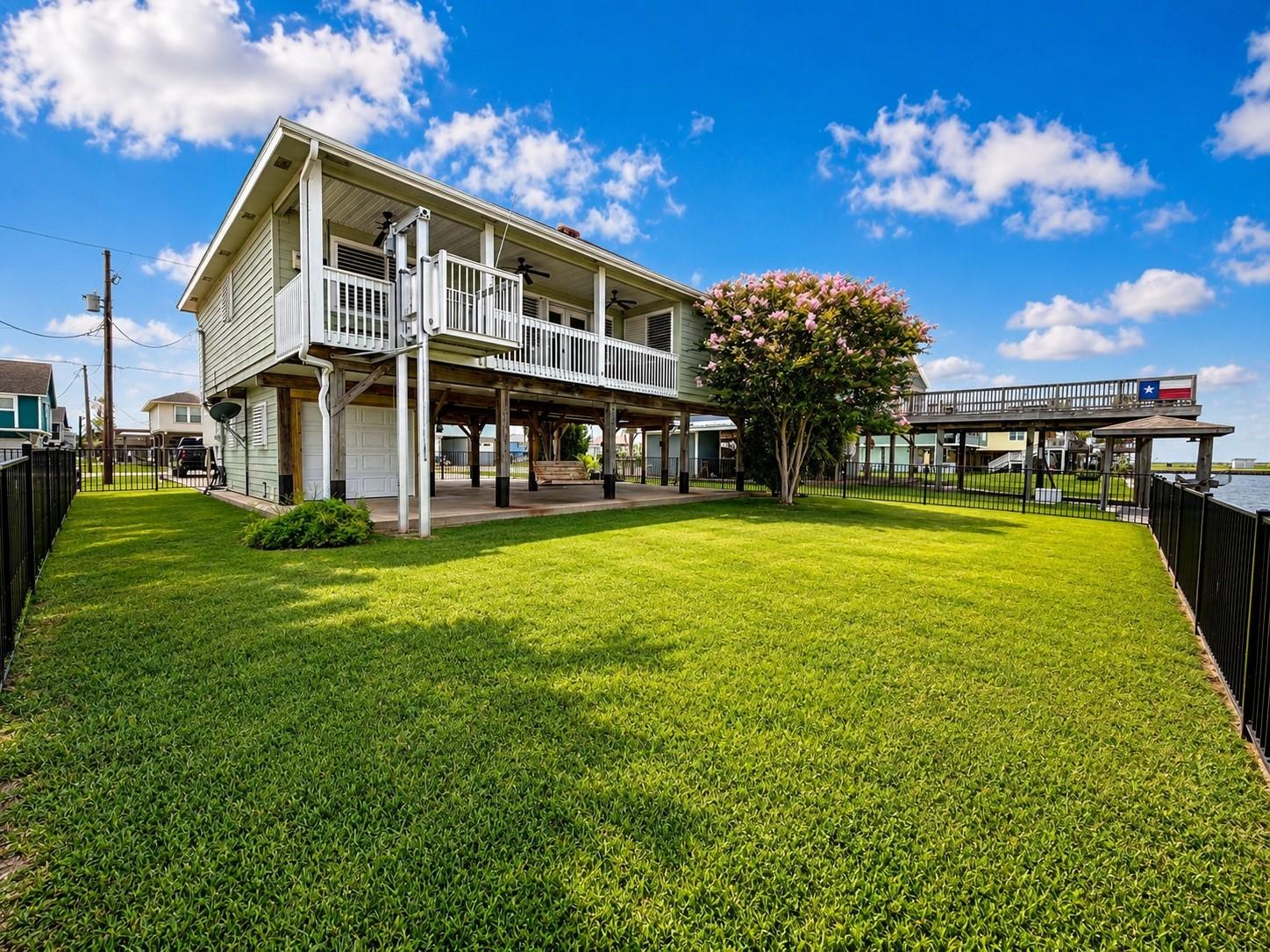 Image 2: This property features a well-kept, two-story home