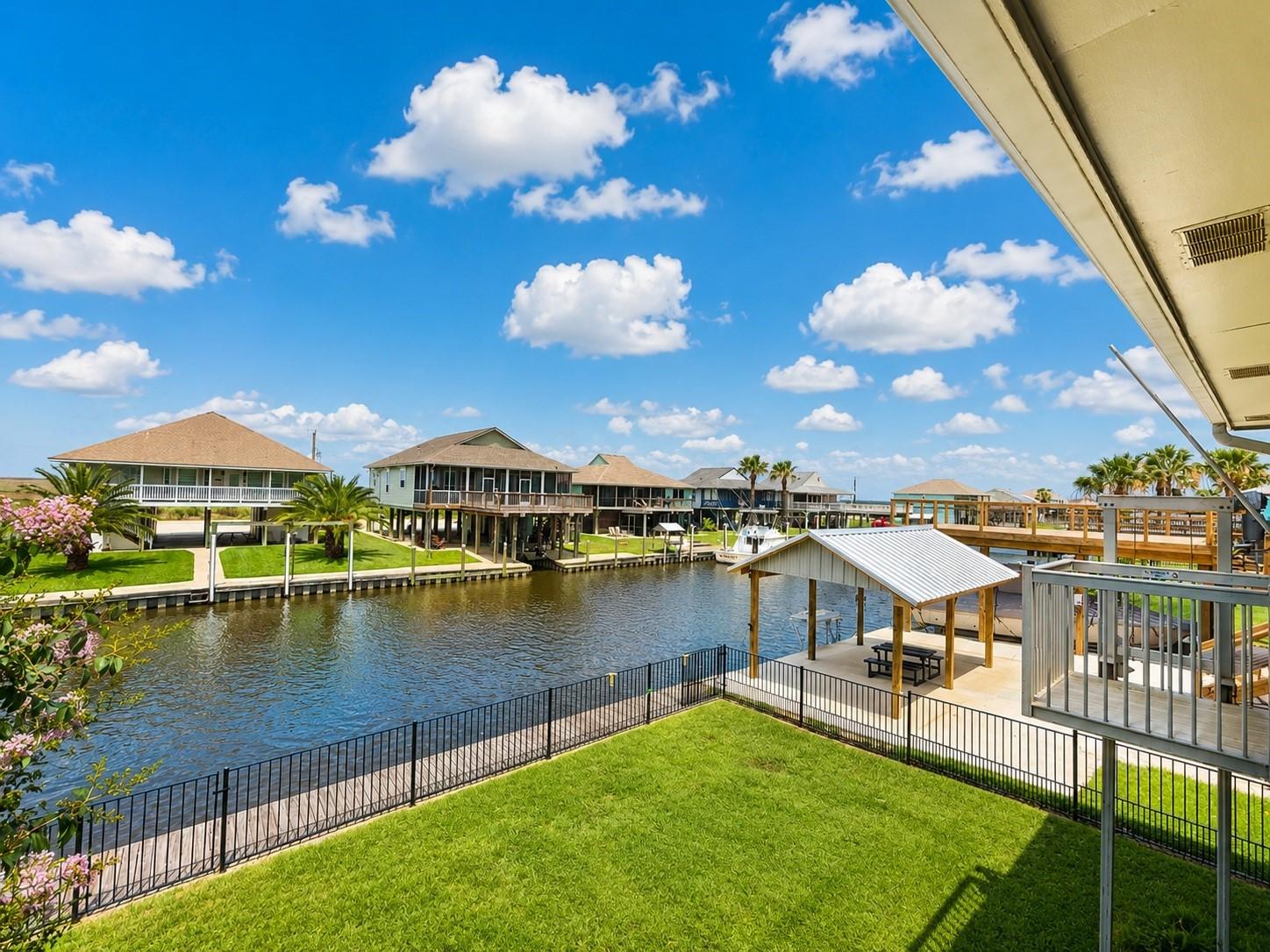 Image 4: This photo showcases a waterfront property with a