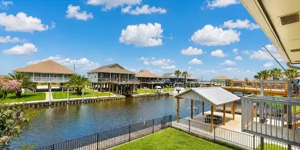 Image 4: This photo showcases a waterfront property with a