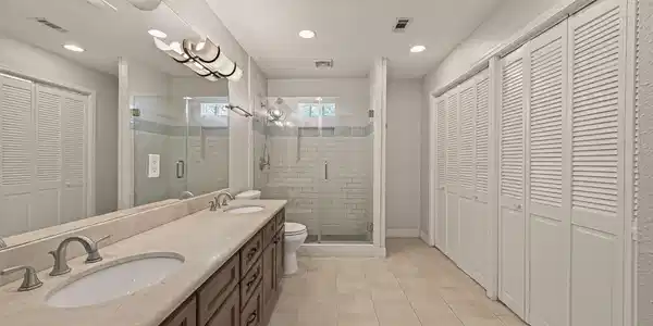 Image 4: Large primary ensuite bathroom wtih walk in closet