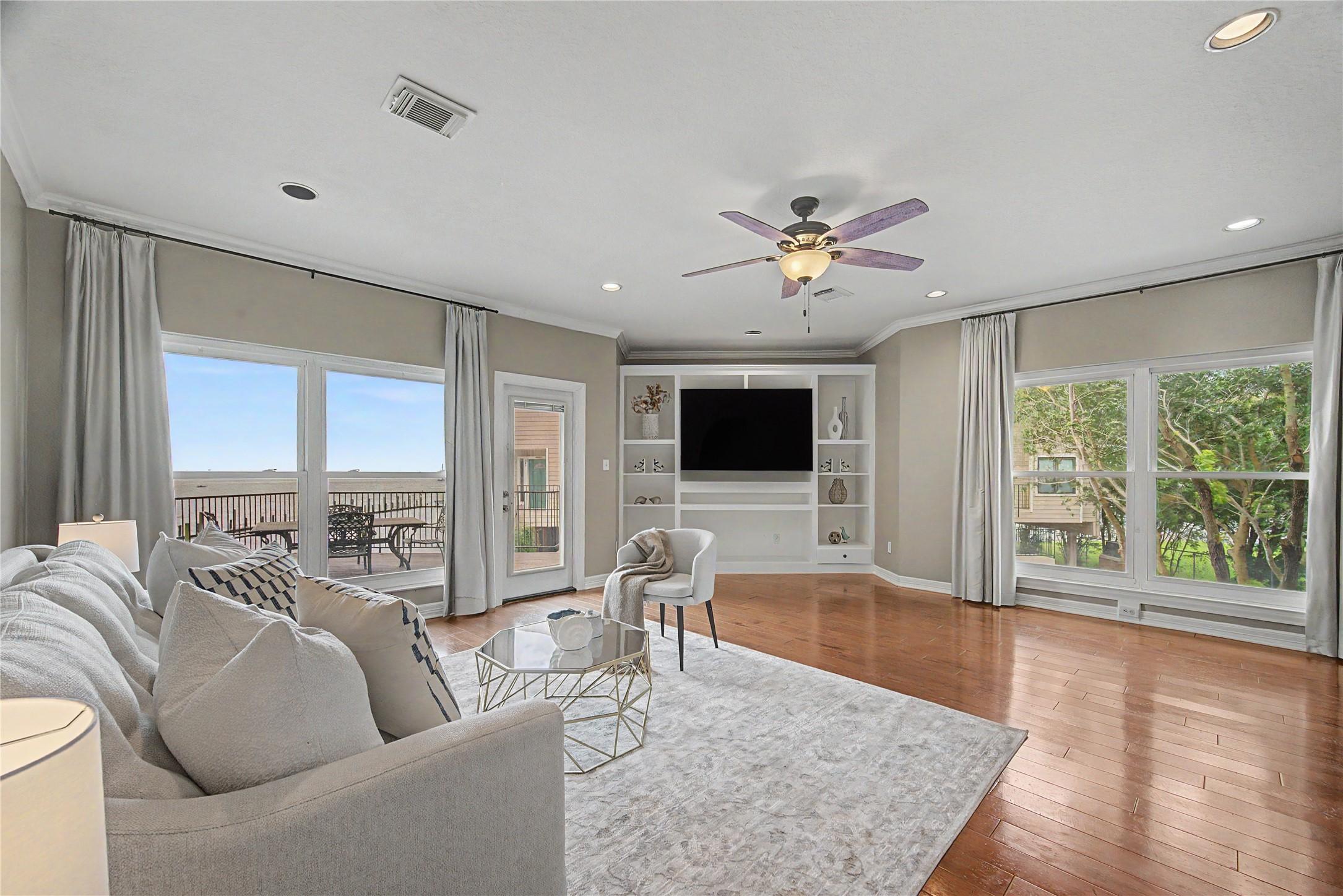 Image 1: view of the open concept living room with a slidin