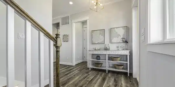 Image 4: Beautiful front entry with access to the stairs.