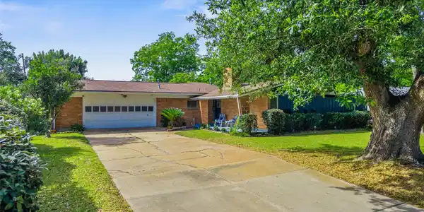 Image 3: Long driveway, inviting front porch, covered acces