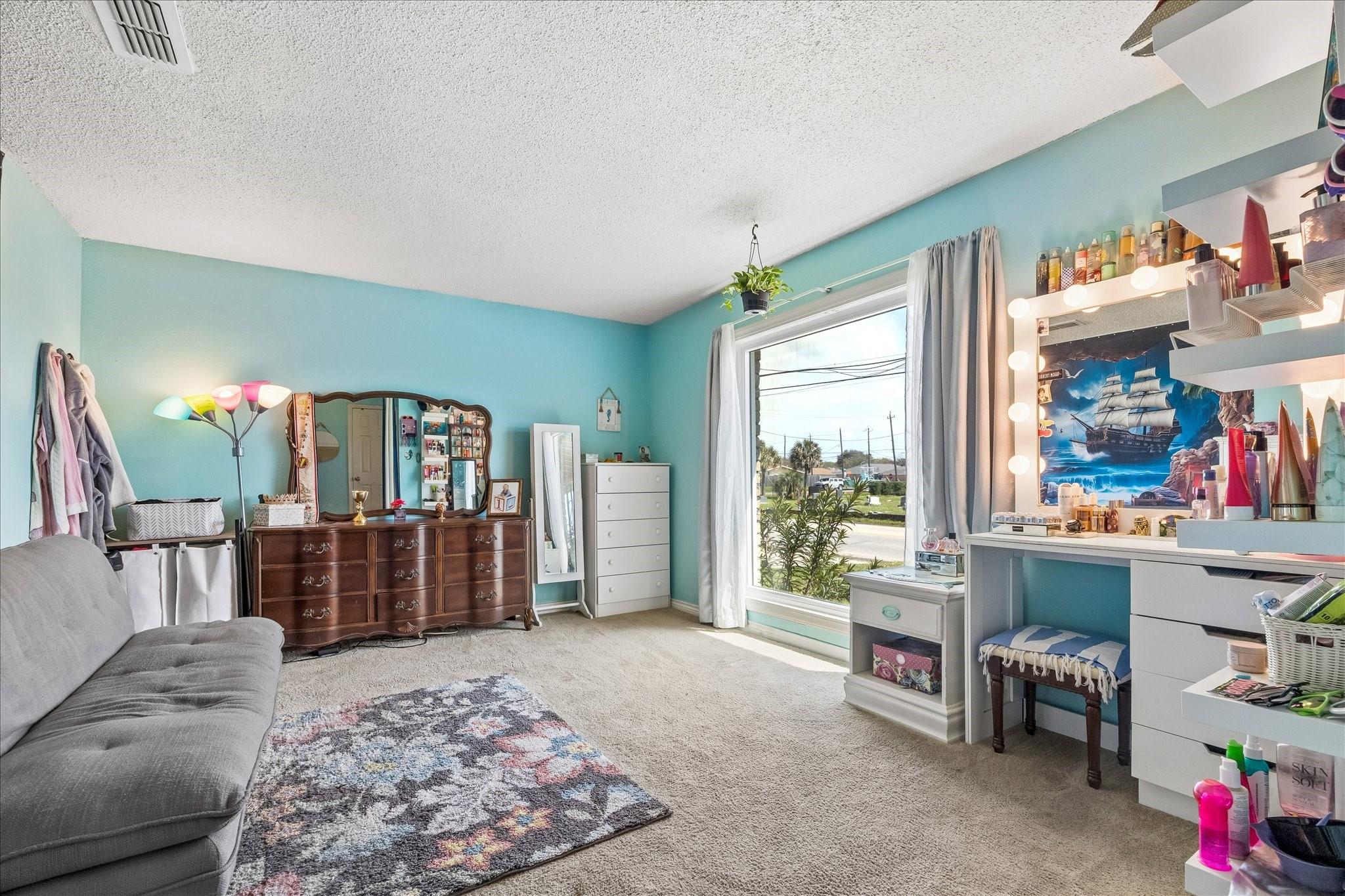 Image 4: The front living room space is a flexible space an