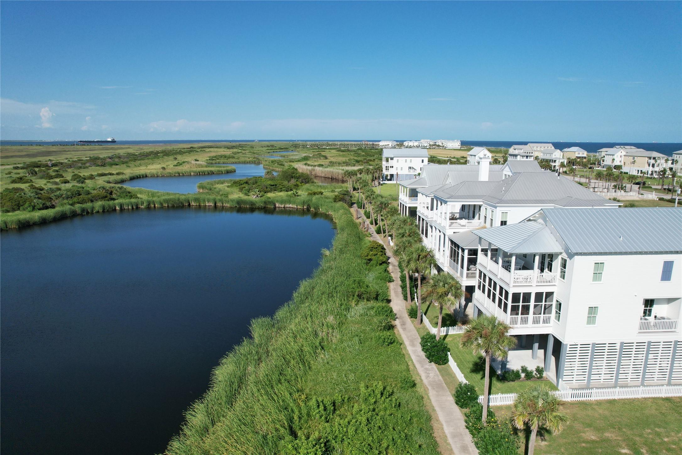 Image 1: Beachtown lagoons with Galveston Bay in the backgr
